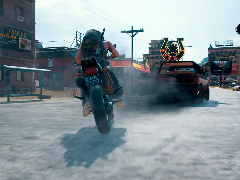 A character speeds on a street bike chasing a truck.